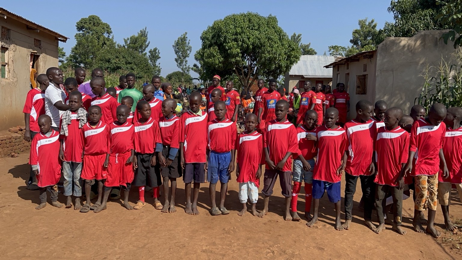 Children wearing red football uniforms
