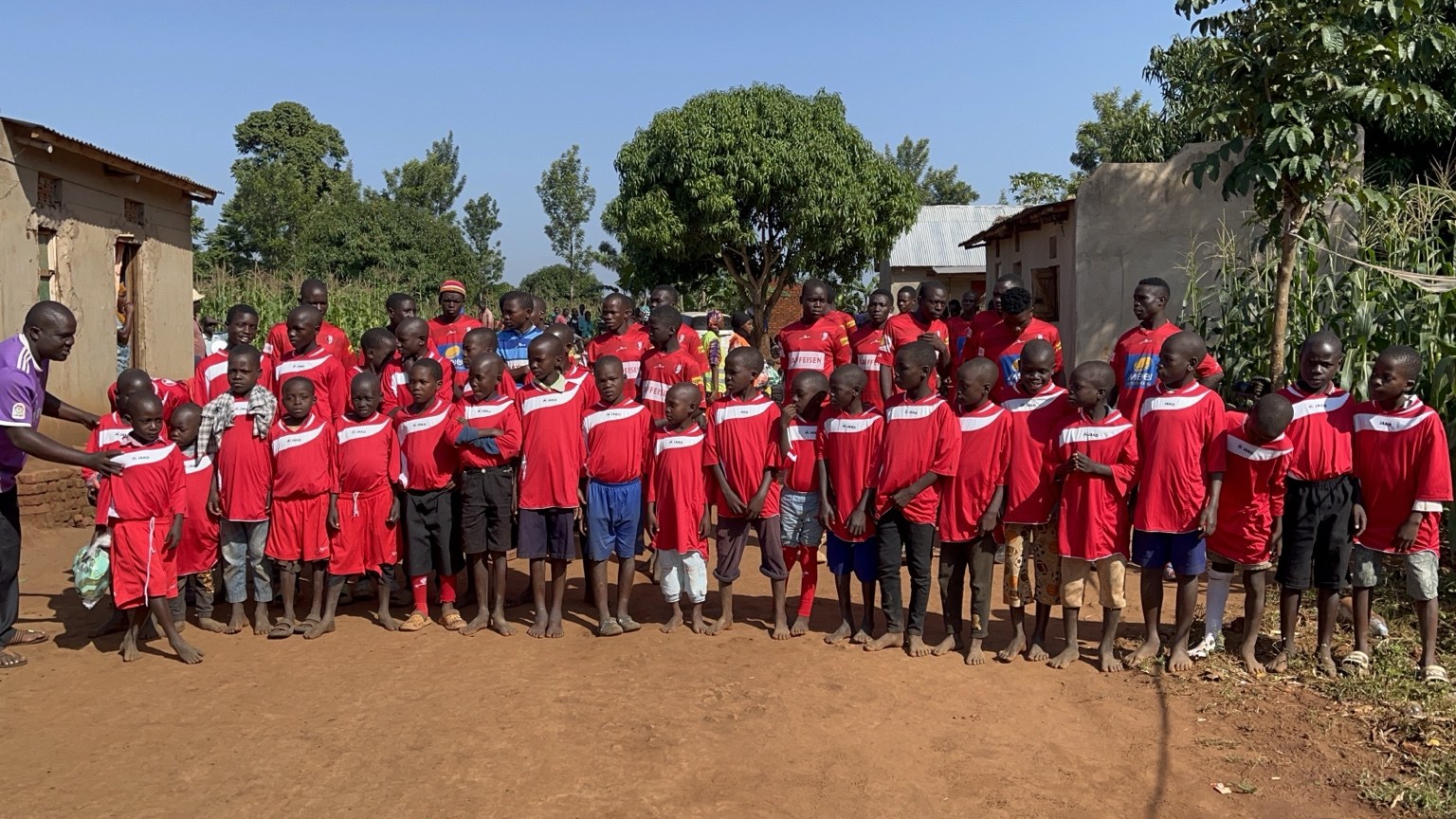 Large group of children in football uniforms