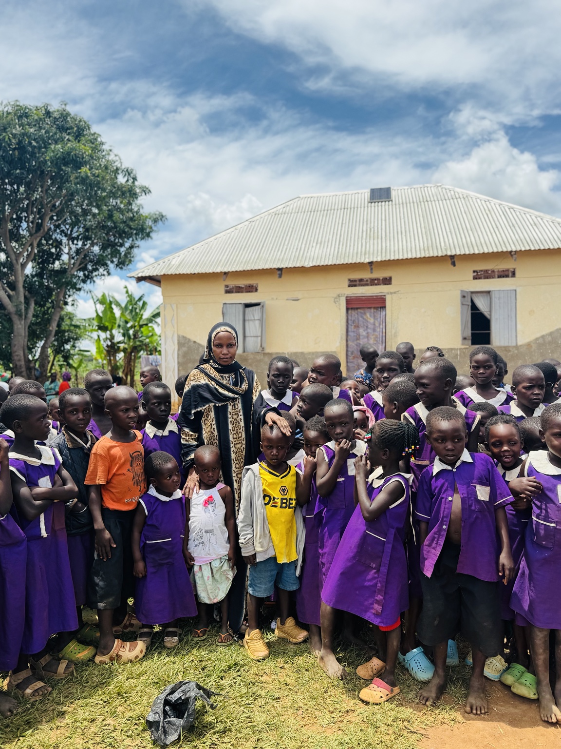 Schoolchildren gathered with Fatimah Initiative team